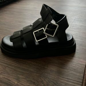Black platform sandals.